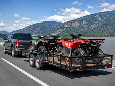 ATVs secured on a utility trailer